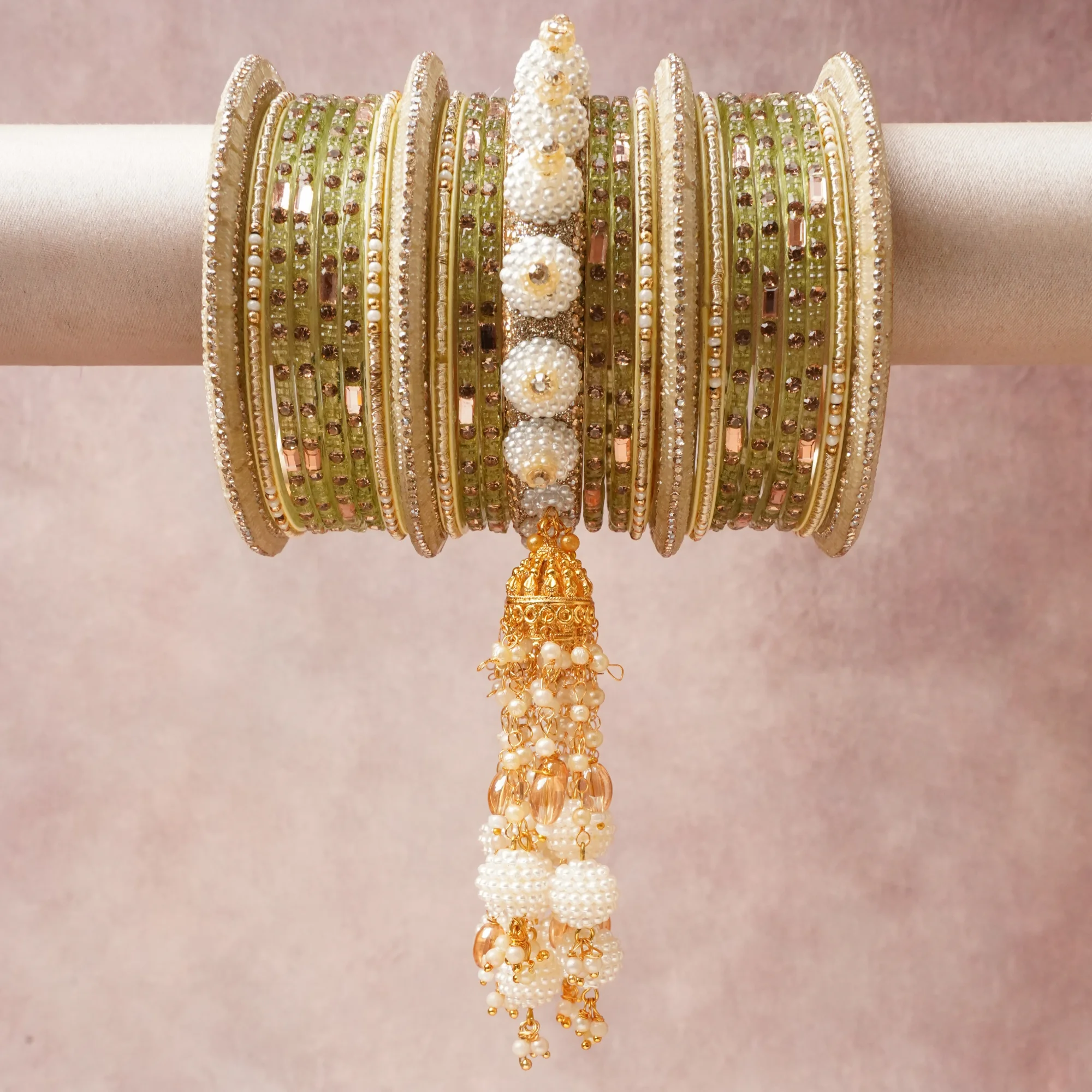 A commanding Muted Olive Green anchors this beautiful set, enriched with accents of Cream, Ivory, Gold, Clear that add depth and dimension.

Featuring a striking composition of Glass, Gold-toned Metal, Faux Pearls, Rhinestones, Seed Beads, this set carries intricate craftsmanship and strong presence. Grand in form, it is created for moments that deserve to be marked.